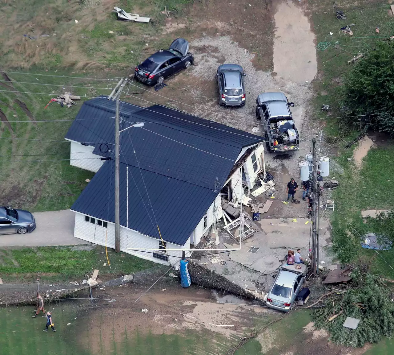 Flood photos from Kentucky, where death toll rises and more rain falls