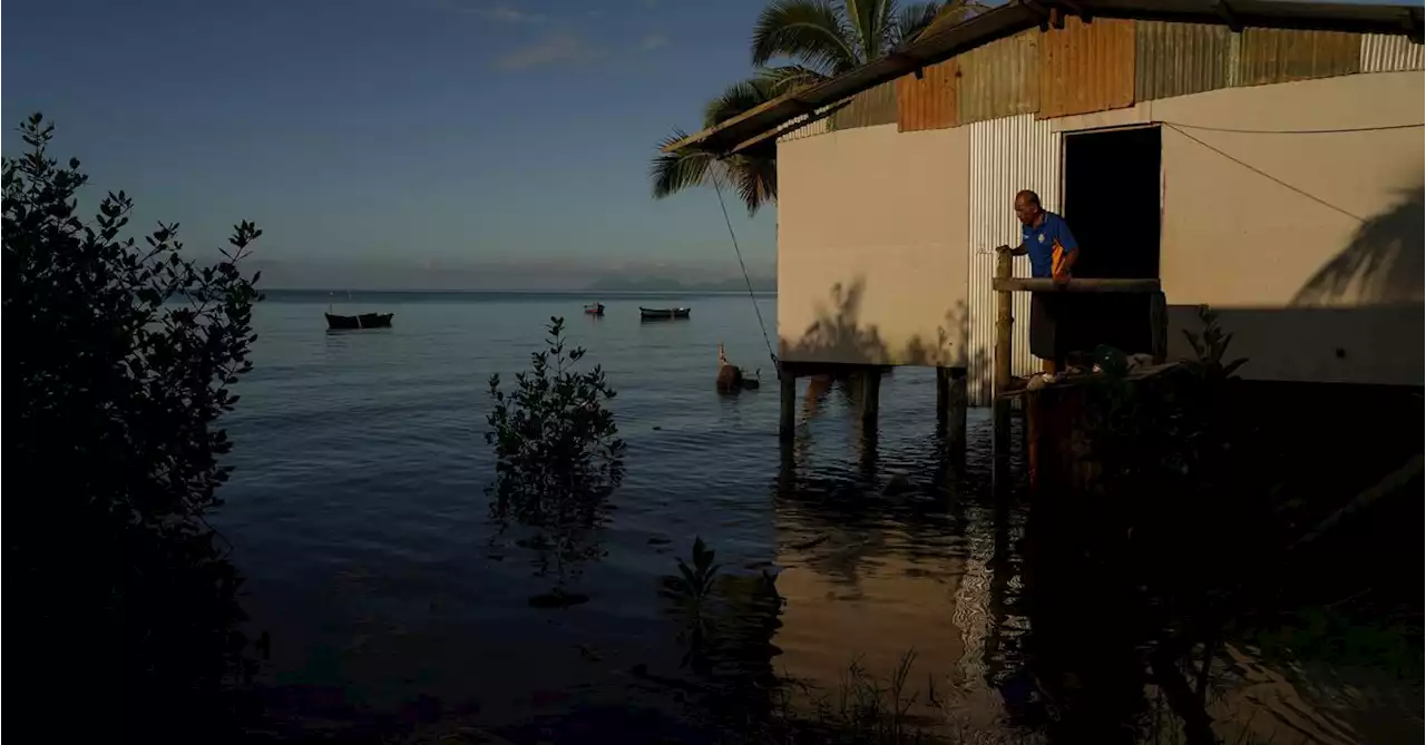 Fiji, moving villages inundated by rising seas, wants big emitters to pay