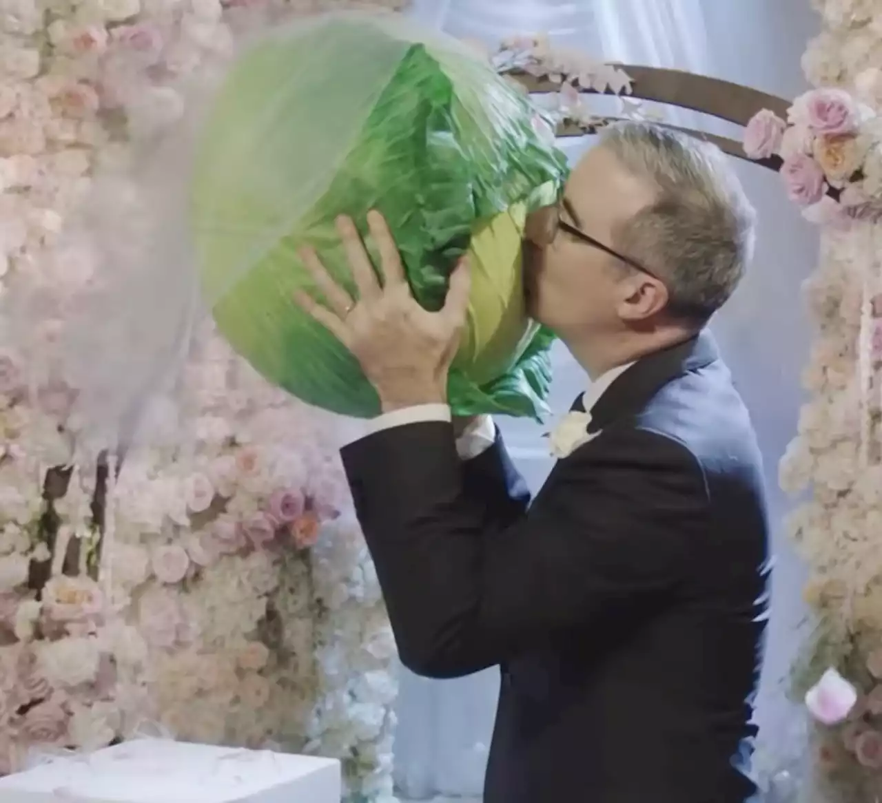 Watch John OIiver Marry a Cabbage Live on TV to Capture the Absurdity of A.I.-Generated Art | Artnet News