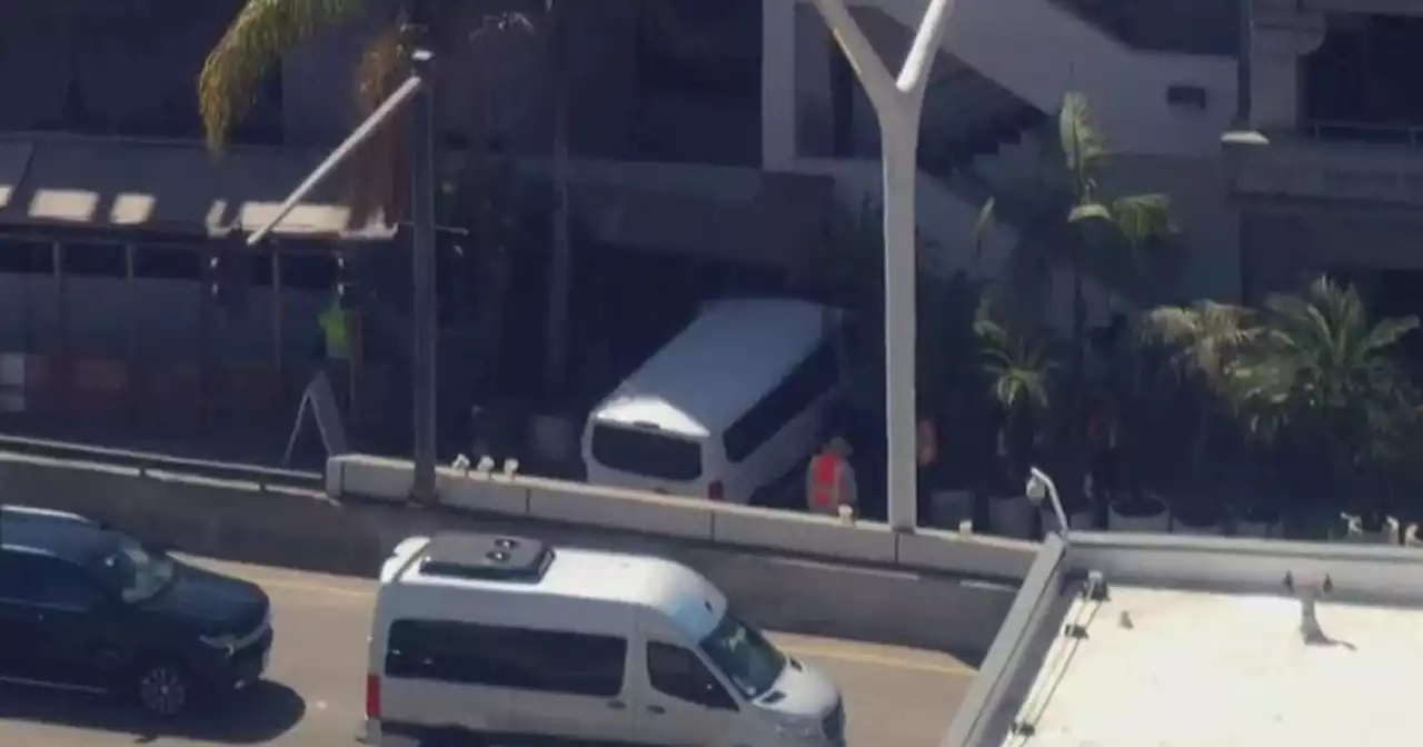 Passenger van hits pedestrians, parking structure at LAX