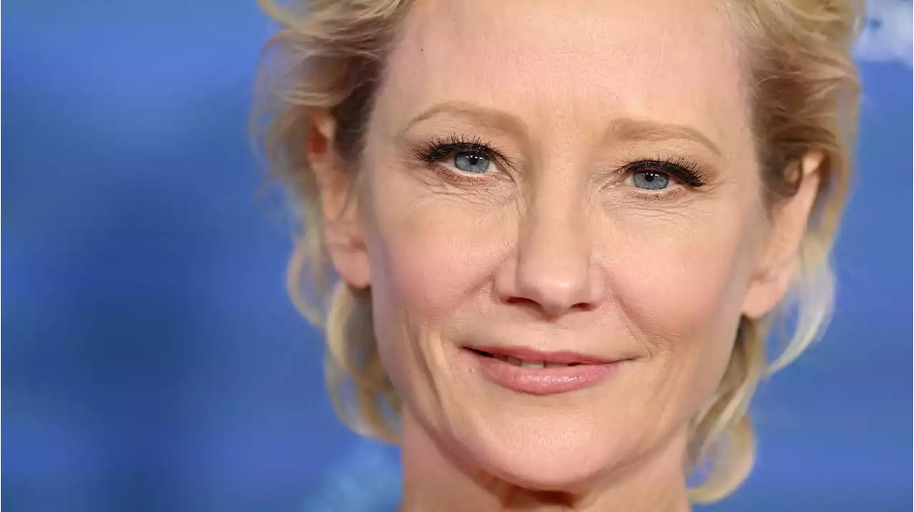 Hollywood actress Anne Heche in critical condition after car crashes 30ft into home and bursts into flames