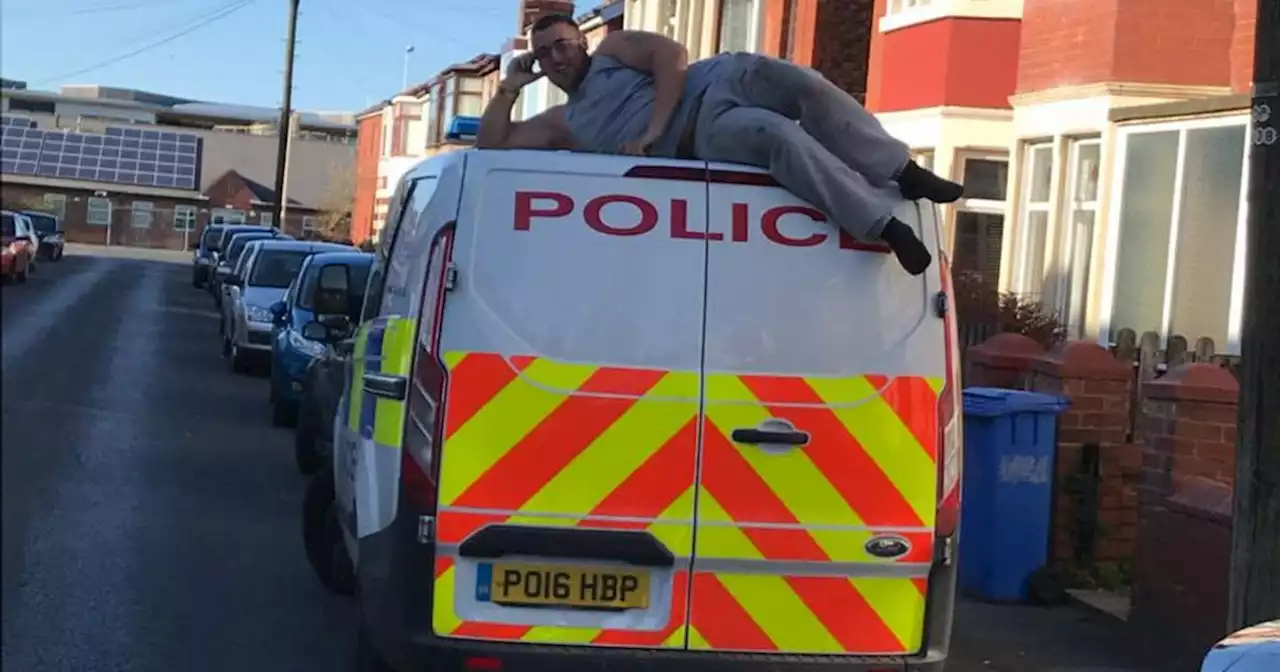 Crook jailed for string of terrifying burglaries poses on top of police van