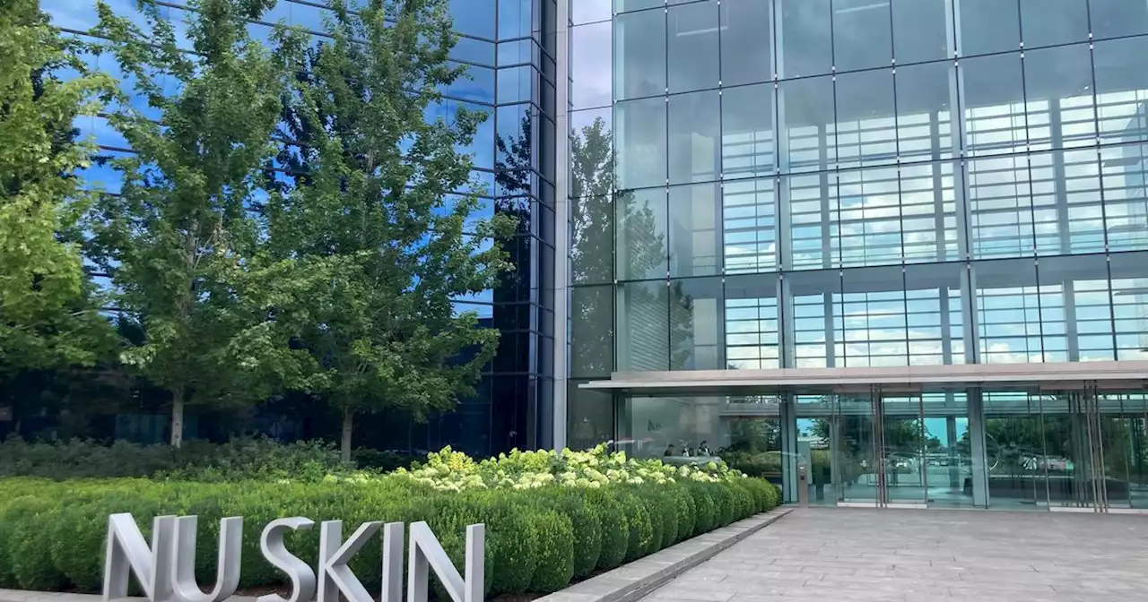 Nu Skin will cut more employees and pay lower taxes as it aims to earn up to $2.4 billion this year