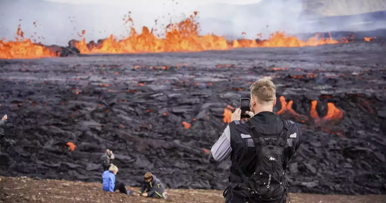 Watch: Hikers flock to admire bubbling lava of erupting volcano in Iceland