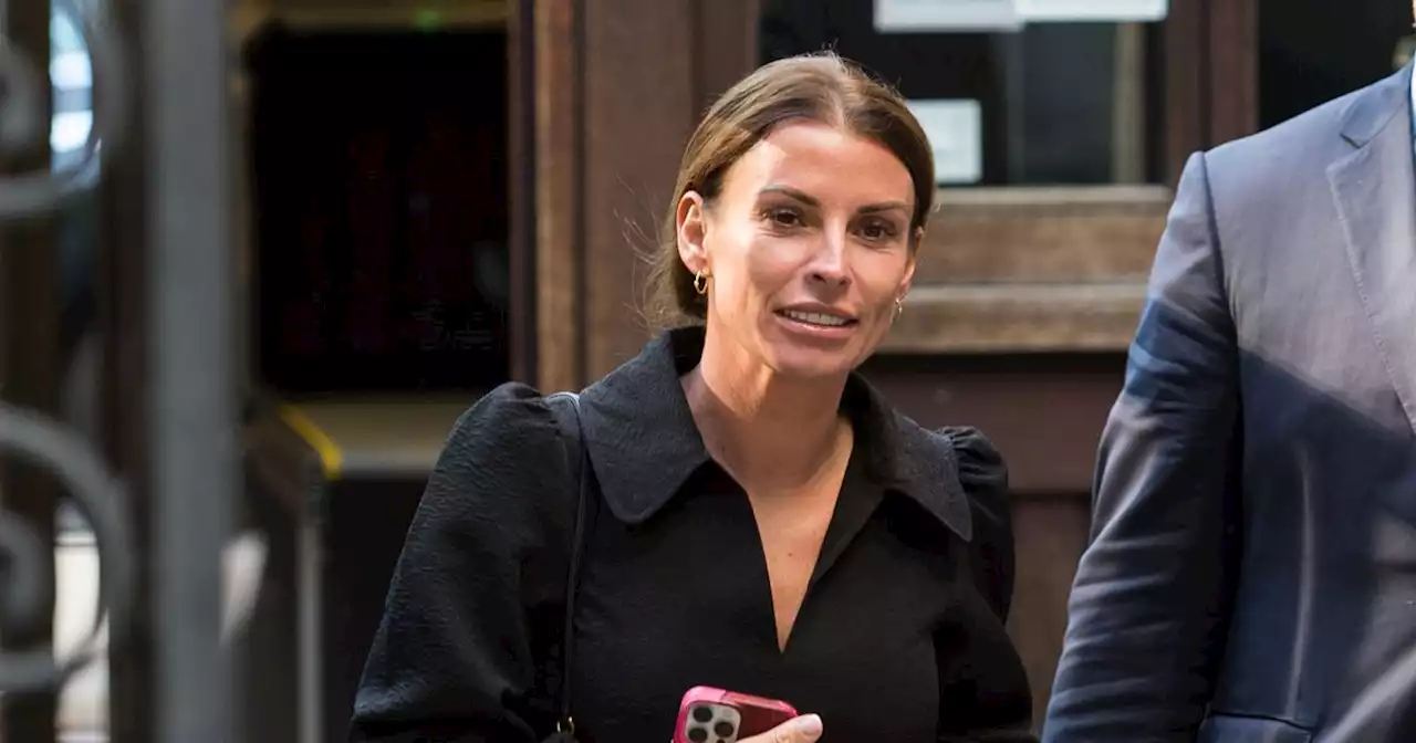 Coleen Rooney smiles with Rylan as they enjoy Westlife gig following Wagatha win