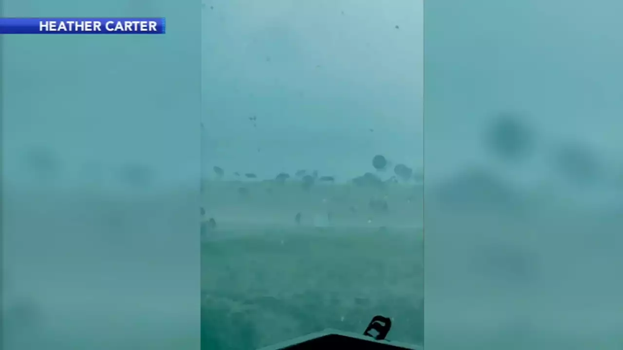 Storm sends umbrellas flying into sea off Bethany Beach, Delaware