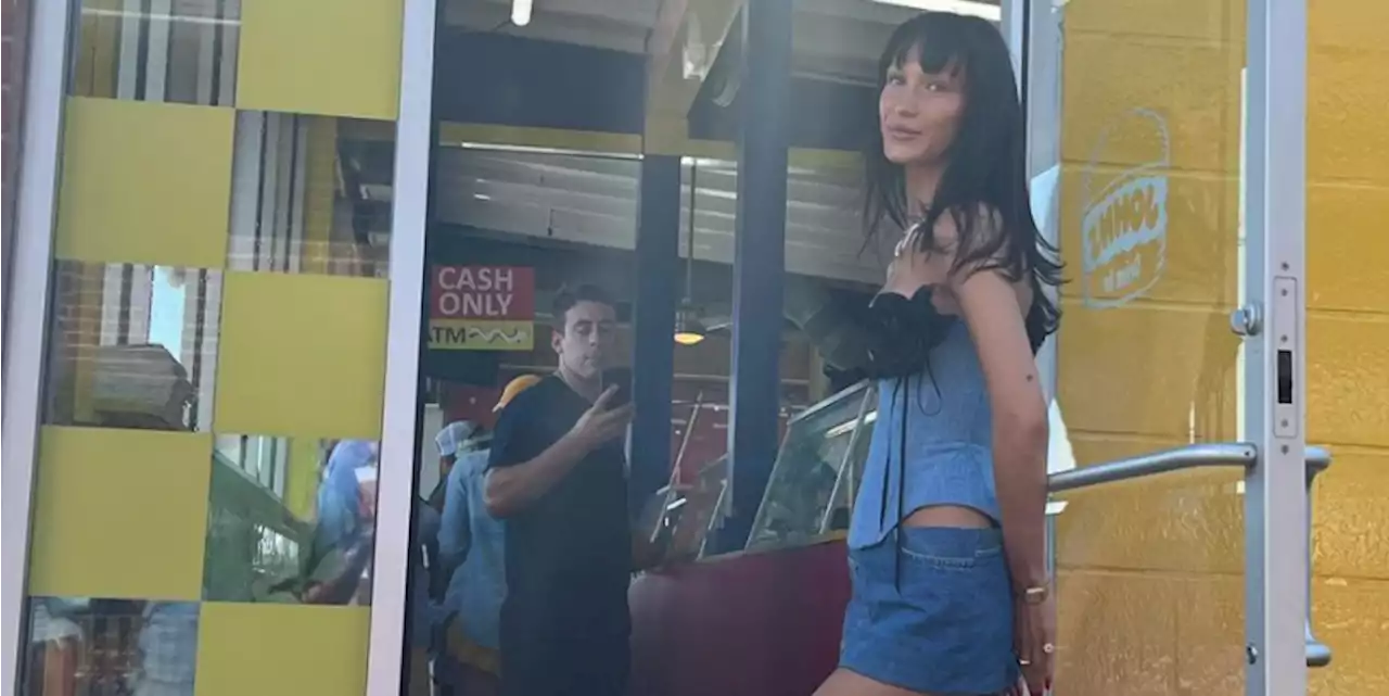 Bella Hadid Styles a Denim Corset with a Micro Miniskirt and Extra-High Socks