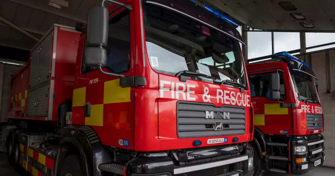 Fire closes road and destroys garden shed