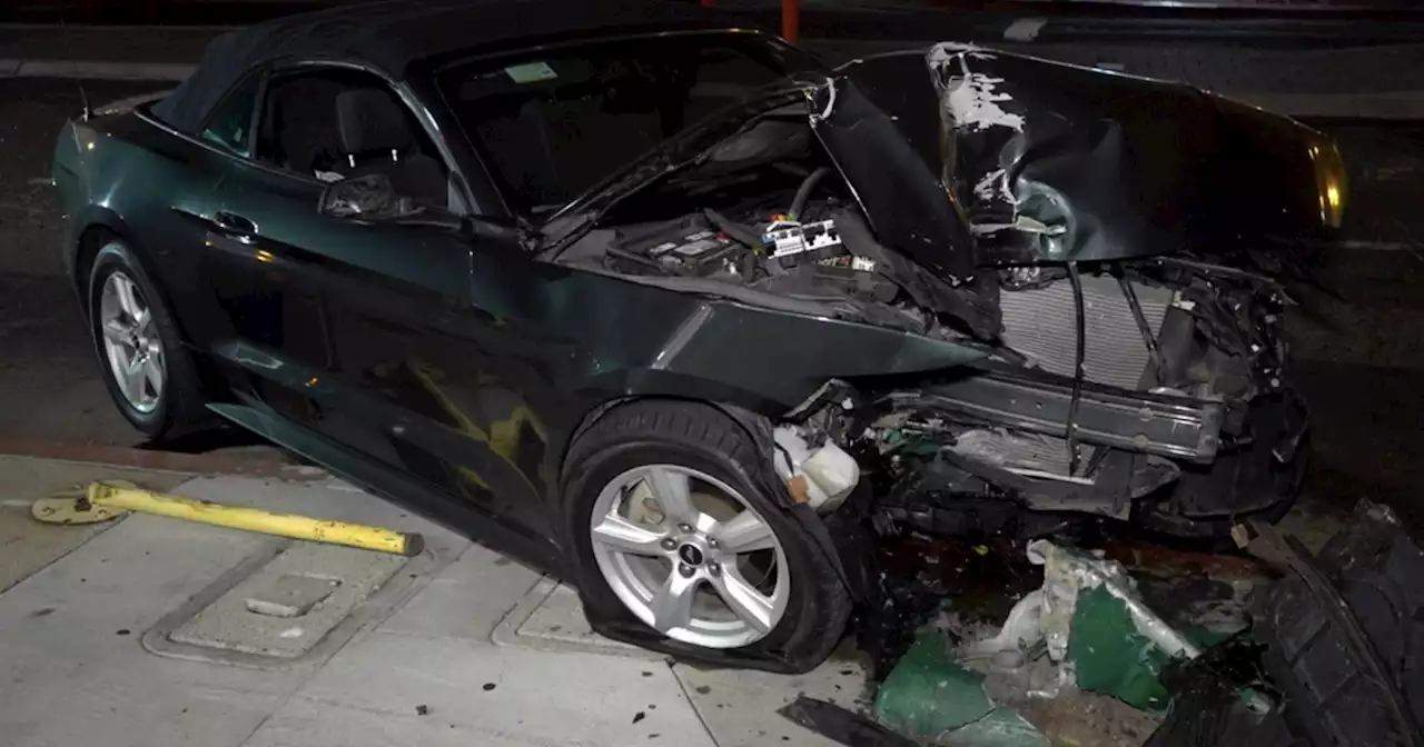 Mustang driver arrested after crashing into North Park light pole