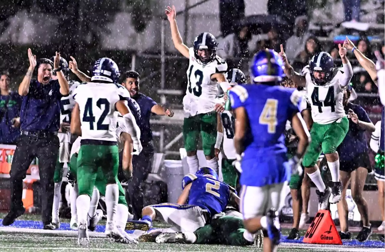 Photos: Rainy, windy Friday night for high school football games