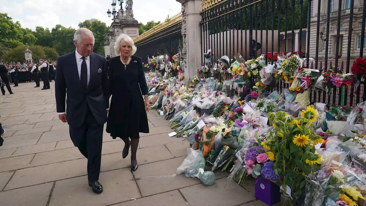 King Charles III and Queen Consort Camilla greet well-wishers outside Buckingham Palace