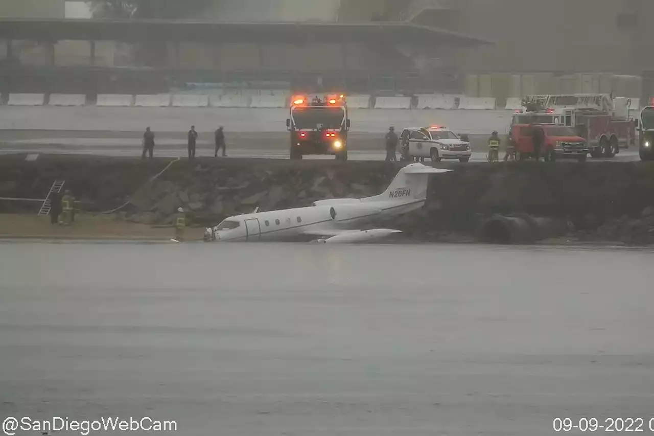 Navy plane crash lands on banks of San Diego Bay