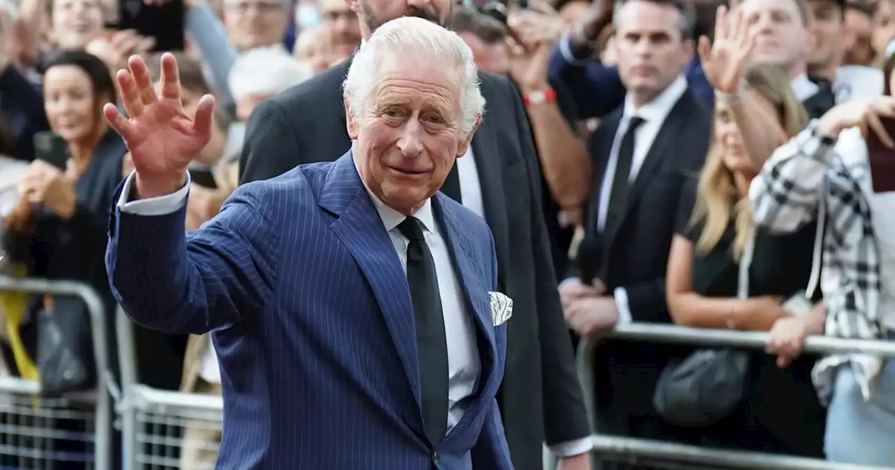 King Charles III greets crowds shouting 'God save the King' at the Mall