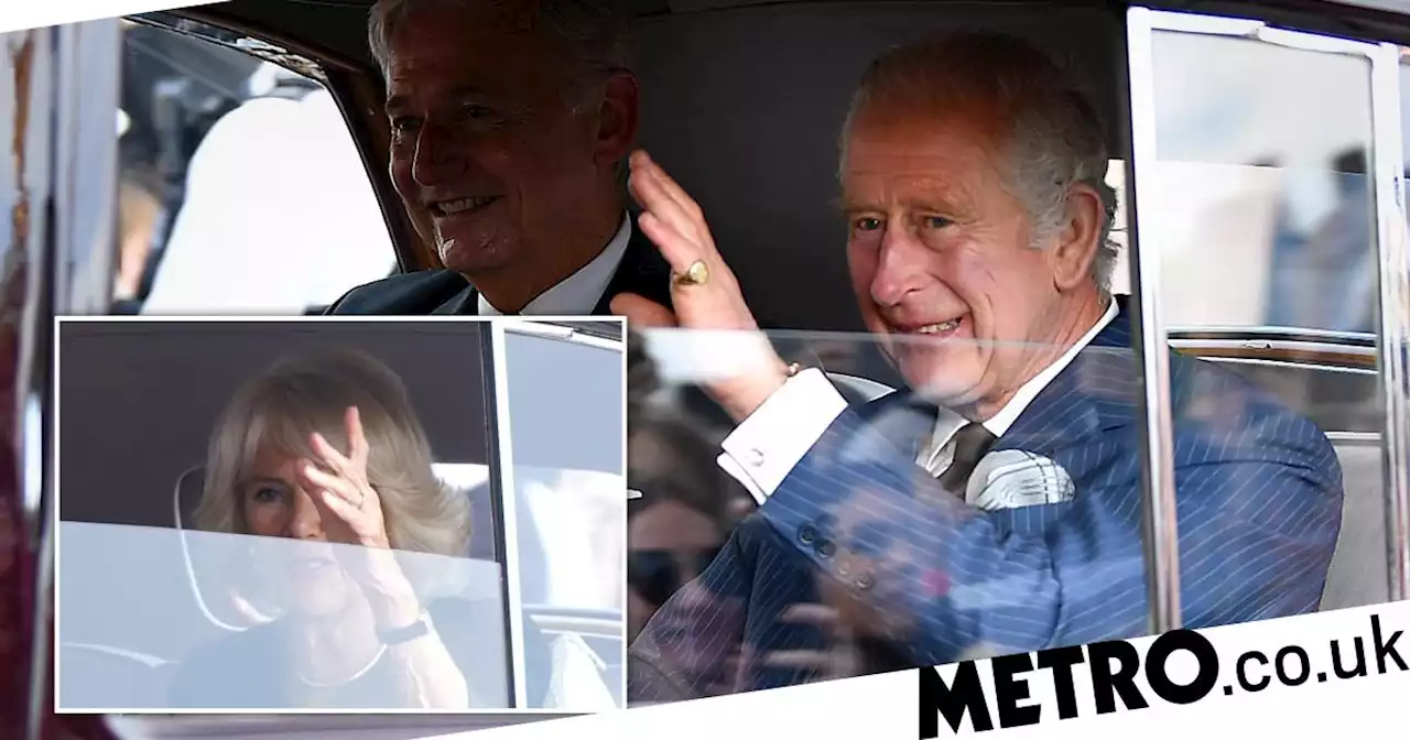 King Charles and Queen Consort Camilla wave to crowds outside Buckingham Palace