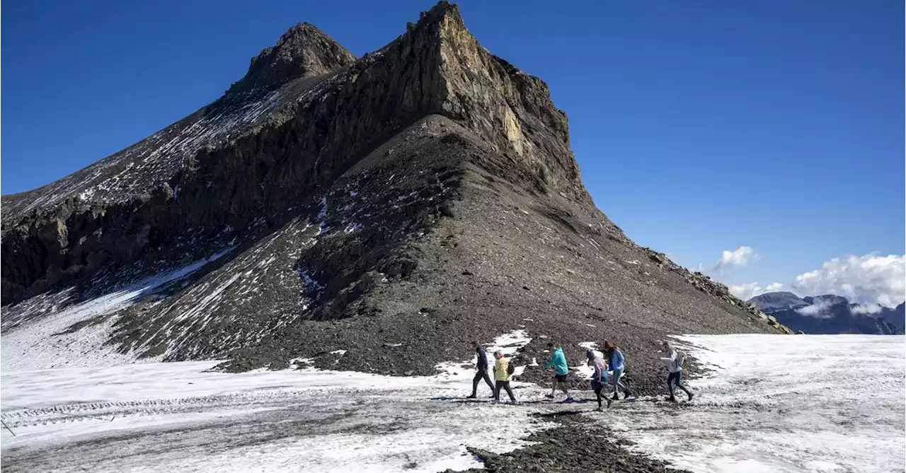 Rocky path revealed between Swiss glaciers in extreme melt season