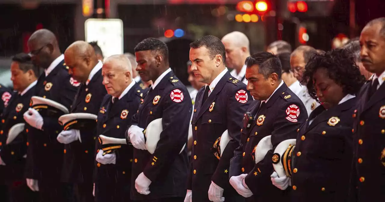 Members of the Chicago Fire Department gather for a moment of silence on Sept. 11 anniversary