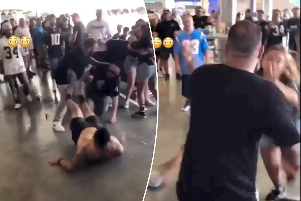 Man punches woman in face during Raiders-Chargers fan fight