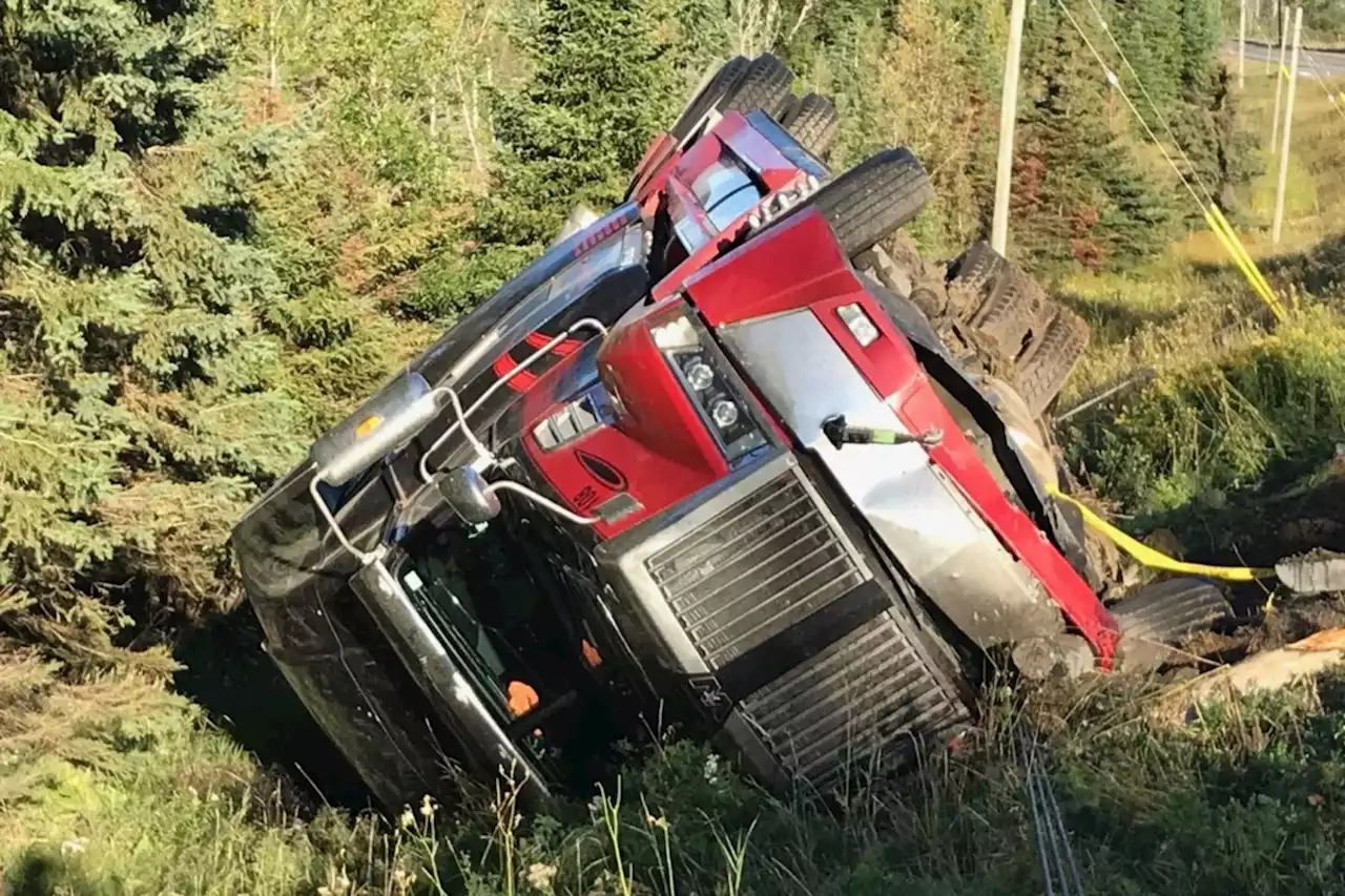 Transport truck overturns on Highway 102