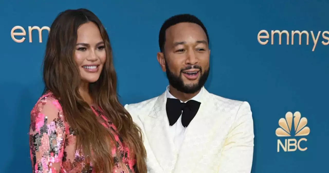 John Legend cradles Chrissy Teigen's baby bump on the Emmys red carpet