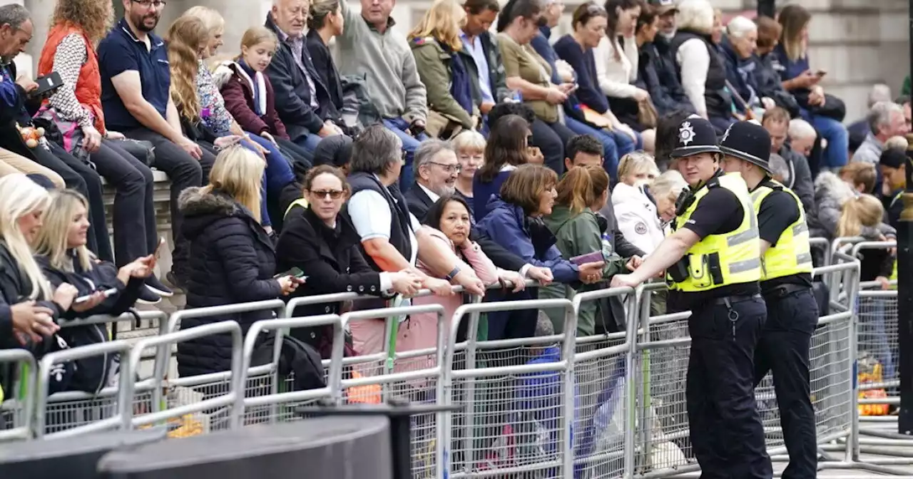 Crowds flock to London to see queen's coffin procession