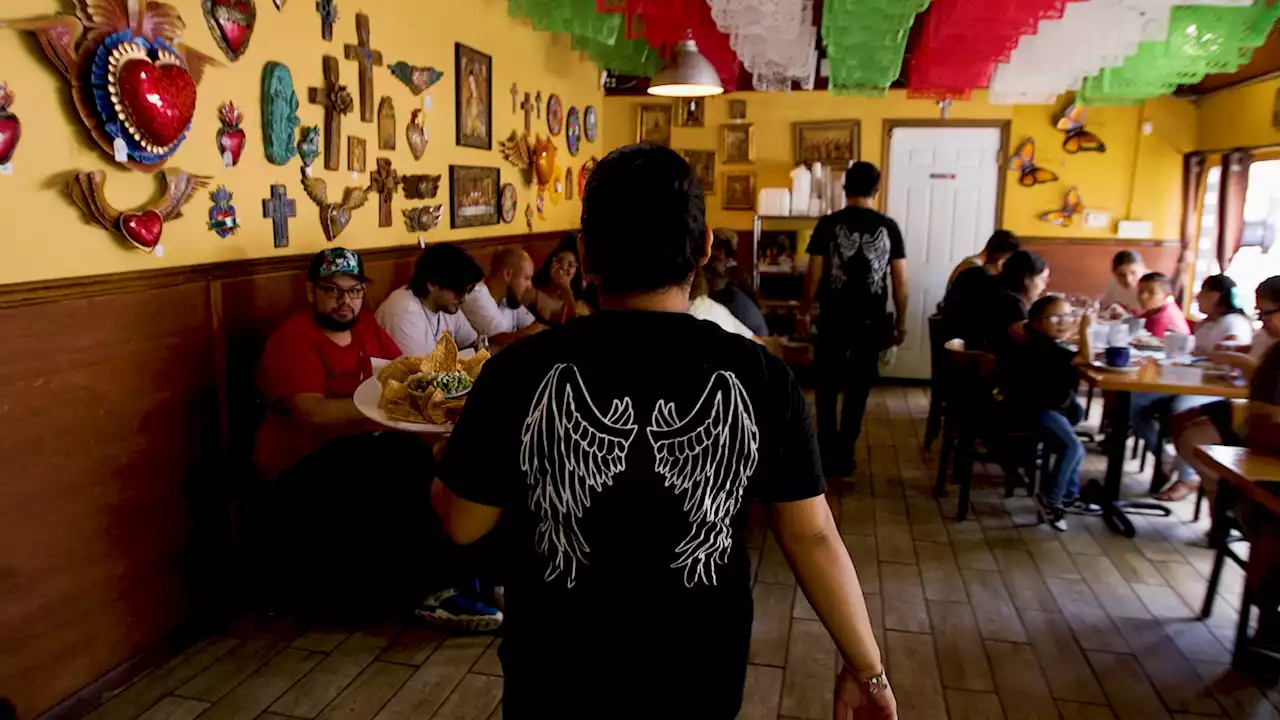 Exorcism cross among hundreds of Catholic items installed in Chicago's La Catedral Cafe