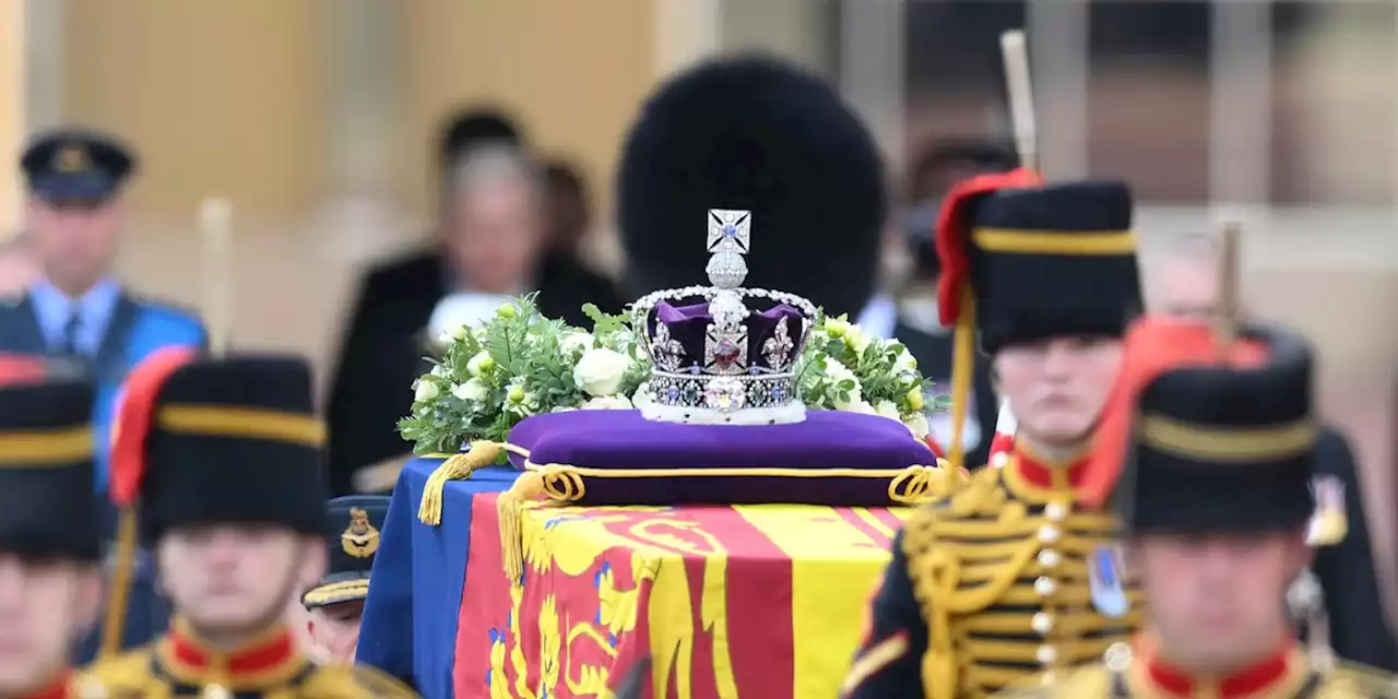 Queen Elizabeth II lies in state after solemn procession