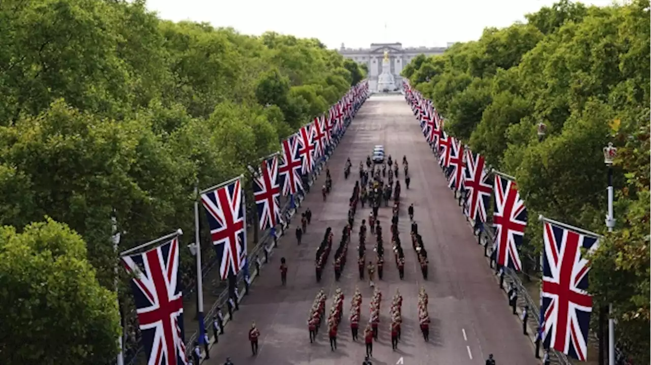 Queen Elizabeth II lies in state after solemn procession