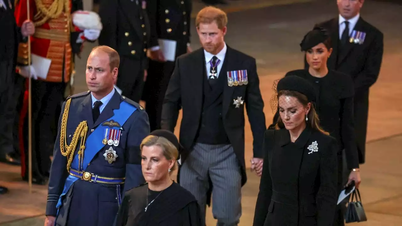 Prince Harry, Meghan Markle Hold Hands as They Exit Queen's Service