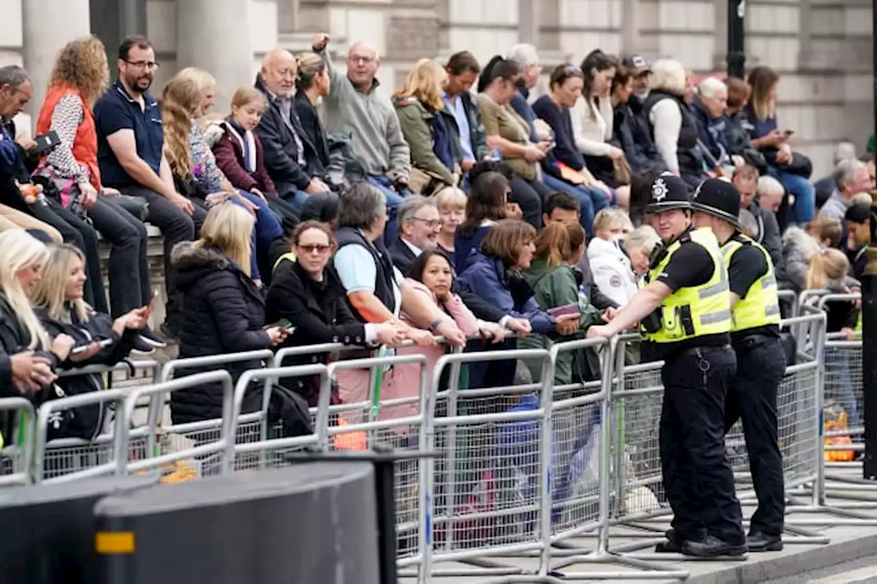 Crowds gather in London to see queen's coffin procession