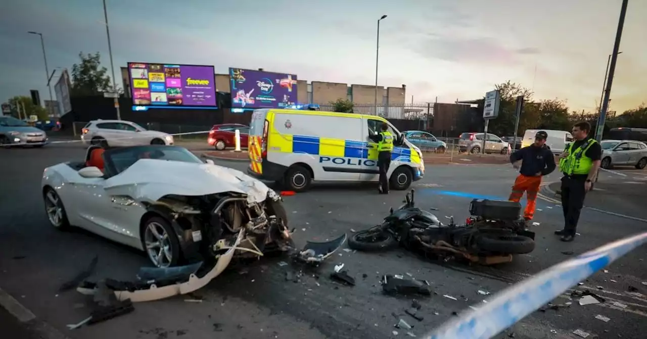 Horror crash between convertible and blood bike closes city centre road