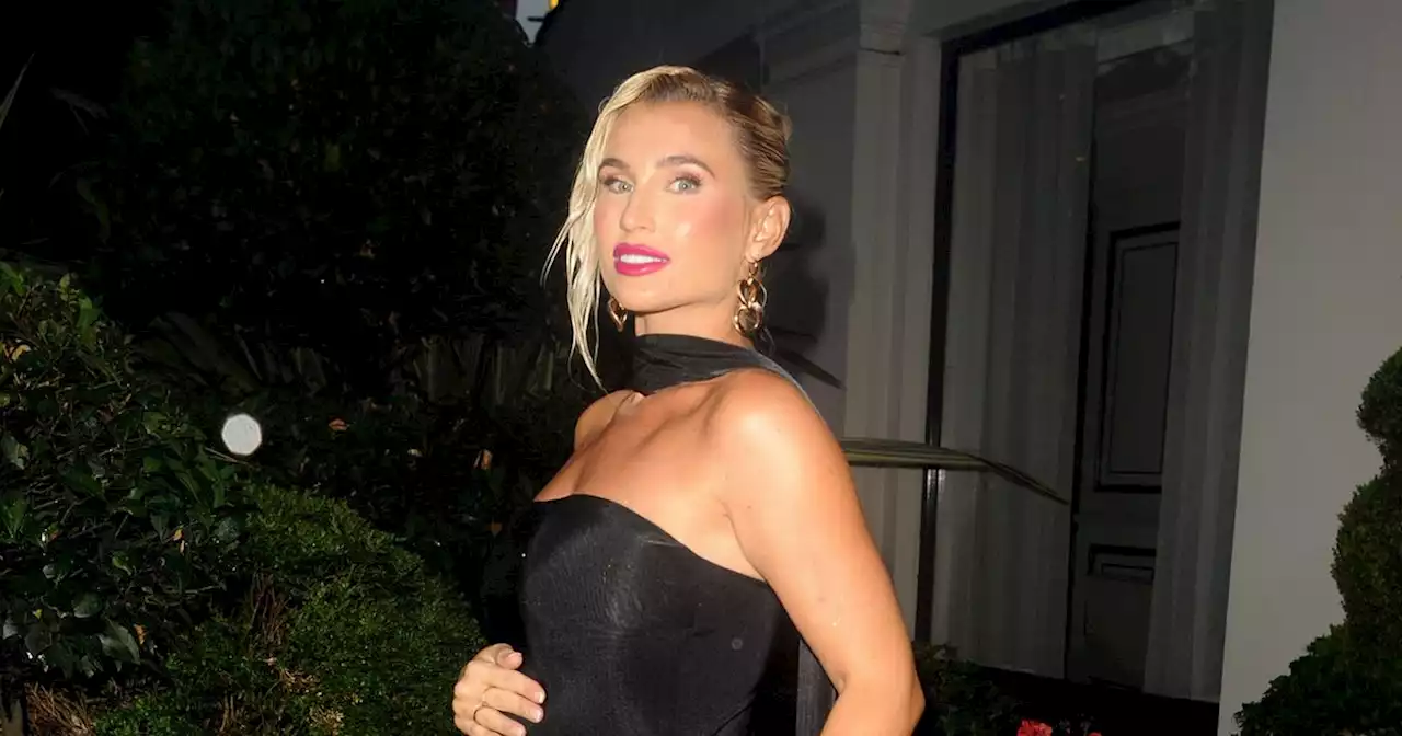 Pregnant Billie Shepherd cradles growing baby bump in figure-hugging black gown