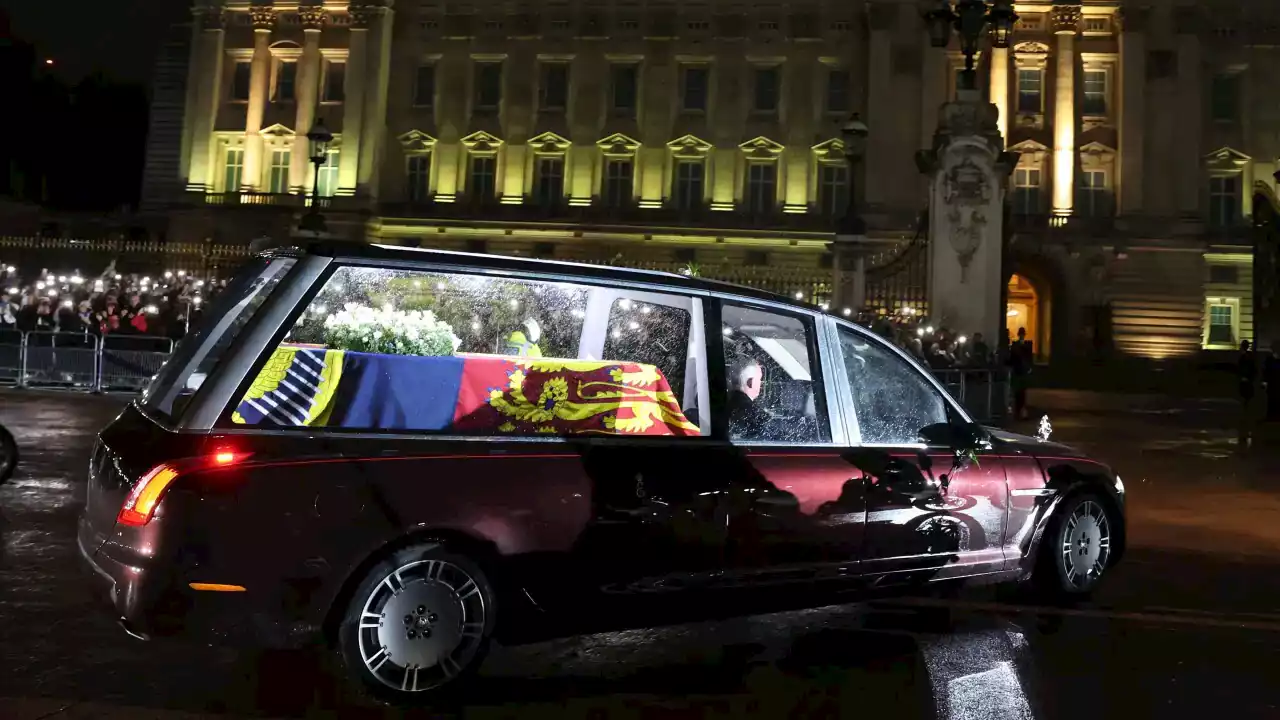 Queen Elizabeth's coffin arrives at Buckingham Palace as huge crowds line streets of London