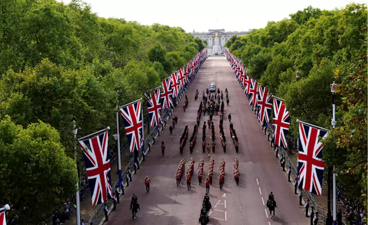 Queen Elizabeth II lies in state after solemn procession