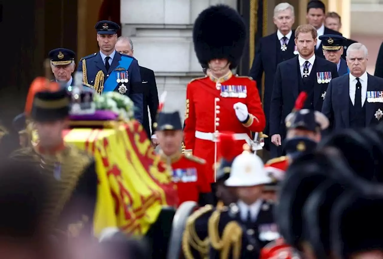 William and Harry walk together behind a loved one's coffin, again