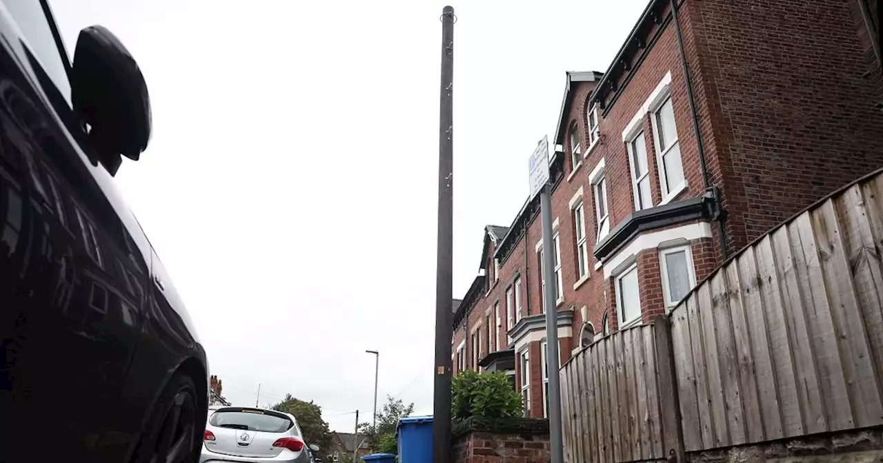 Mystery telegraph poles spring up outside homes with note attached