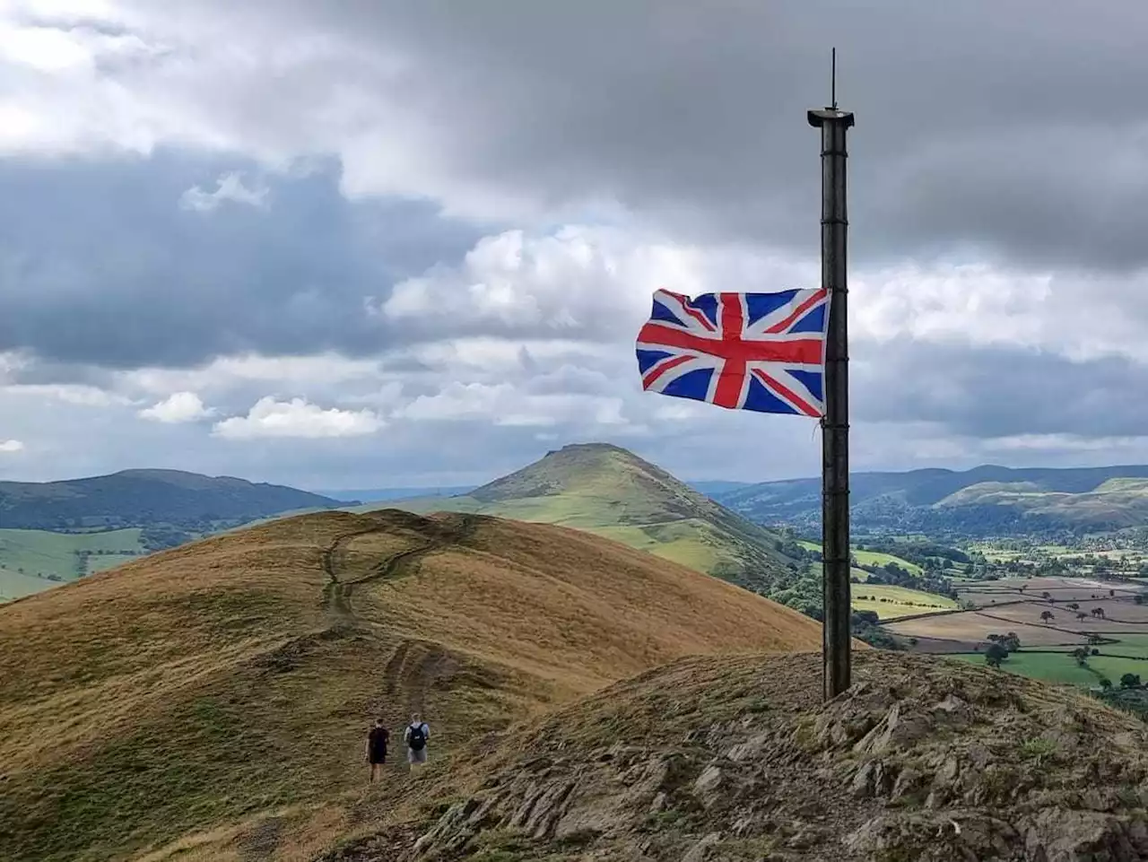 Flag fluttering at half mast on a county high spot symbolises south Shropshire's tribute to the Queen