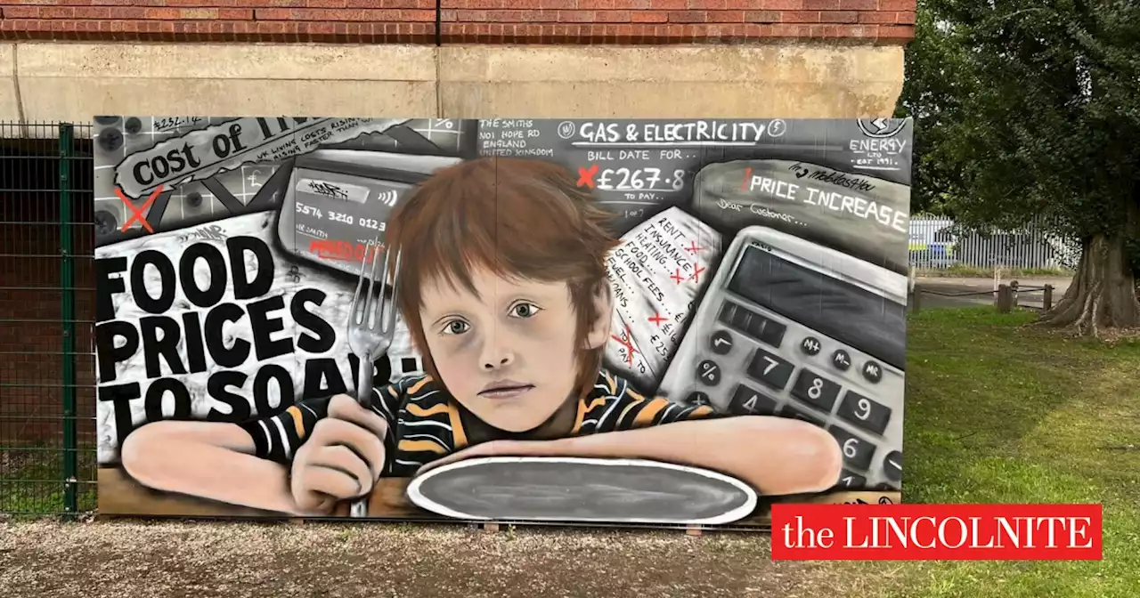 Cost of living street art removed by council, artist promises to auction it for food bank