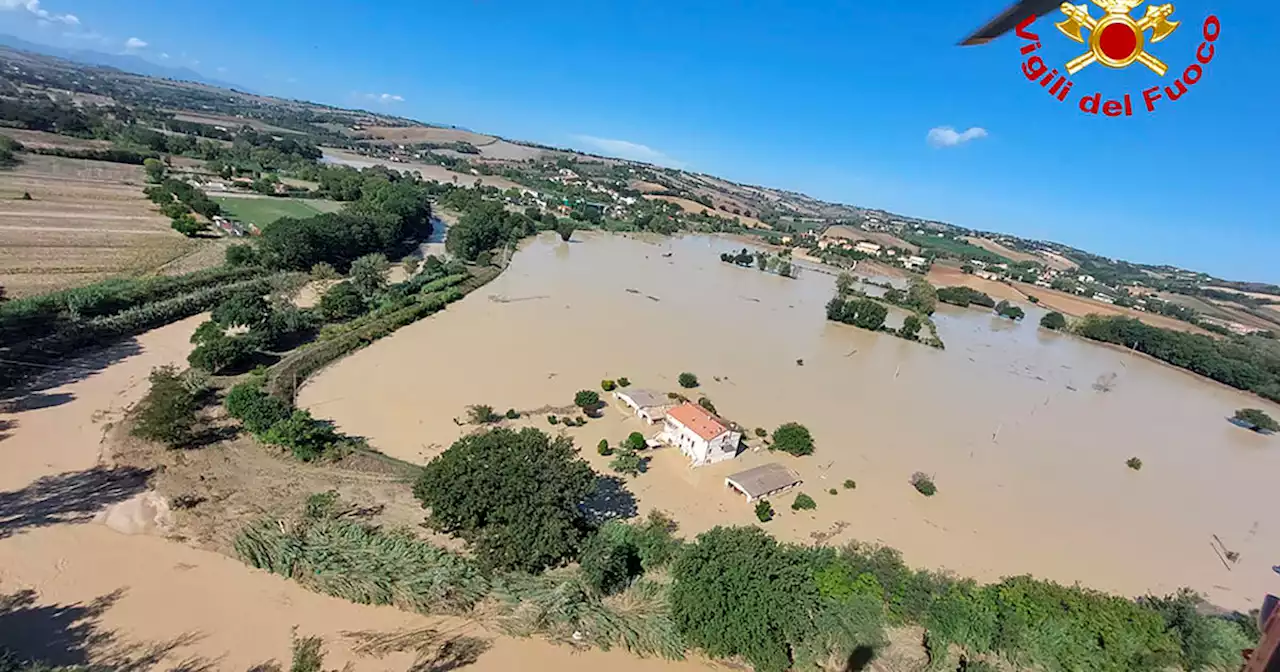 Floods kill at least 10 in Italy as dozens are rescued from rooftops and trees: 'It was a tsunami'