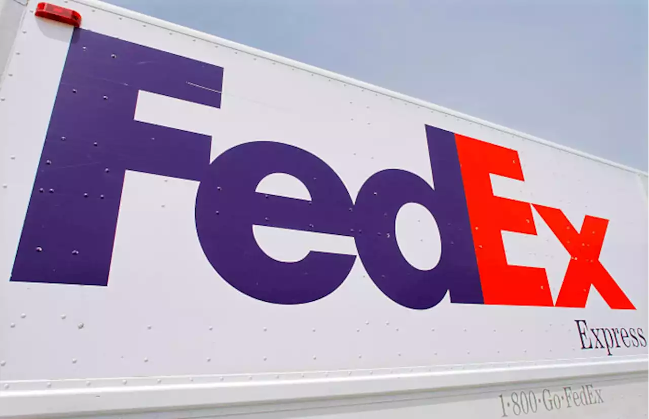 FedEx to close stores, put off hiring as demand slumps