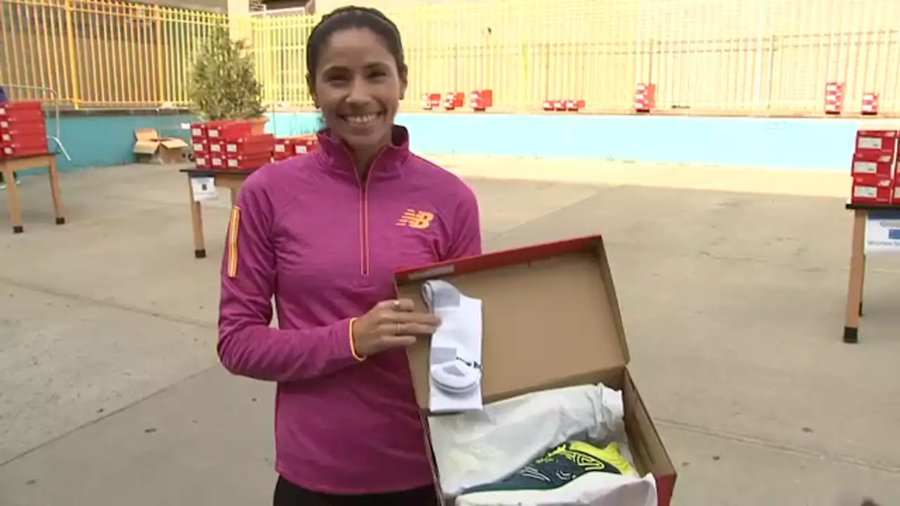 Olympian gives away 200 pairs of free shoes to students at Bronx school