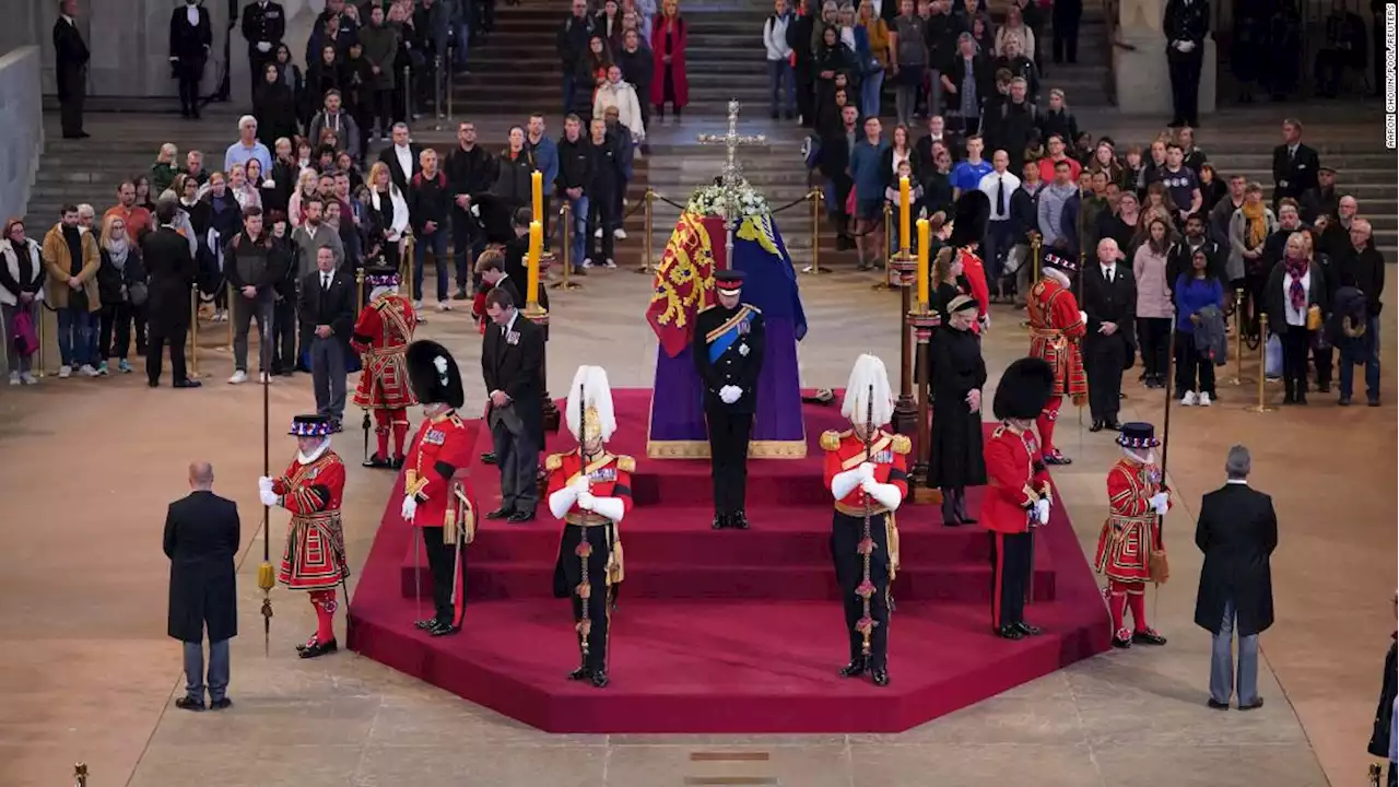 Princes William and Harry lead somber vigil by Queen's coffin