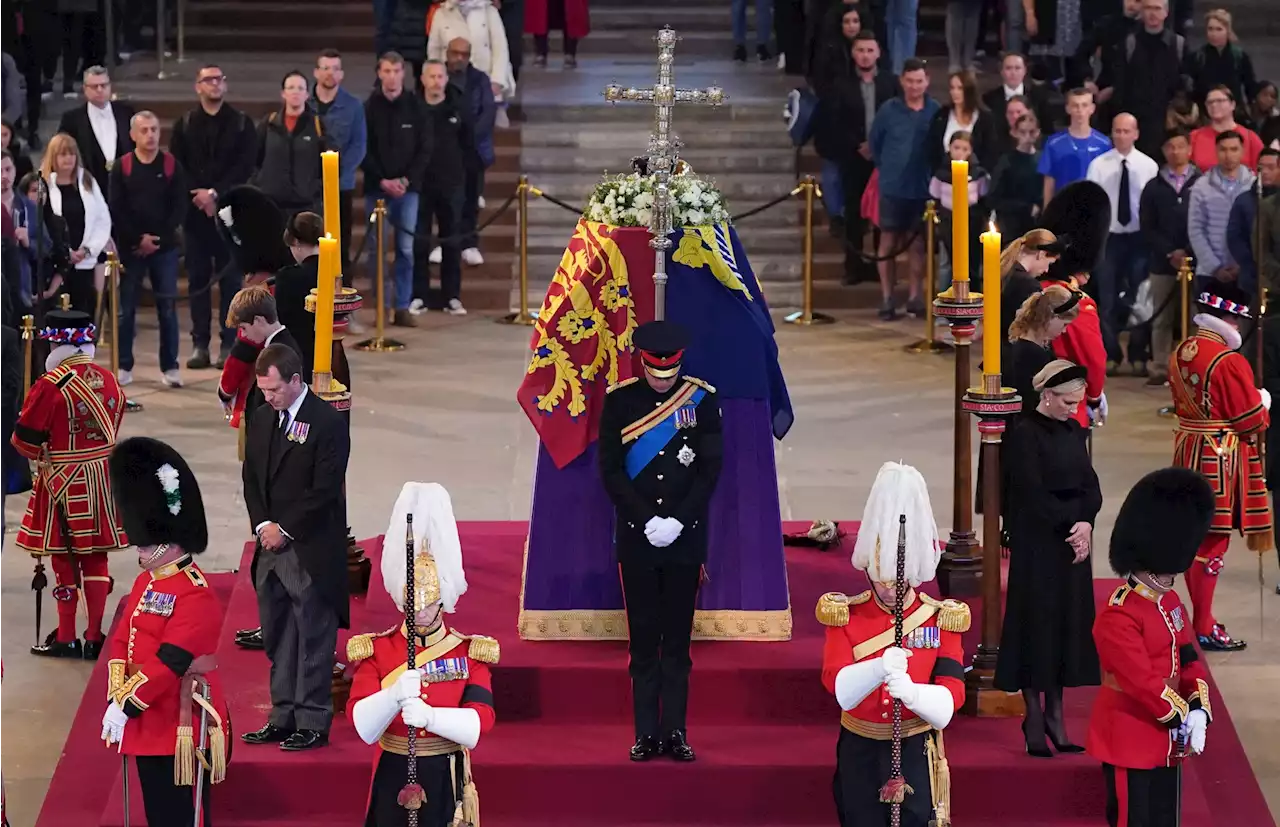 Prince William and Harry stand vigil beside Queen's coffin with her other six grandchildren