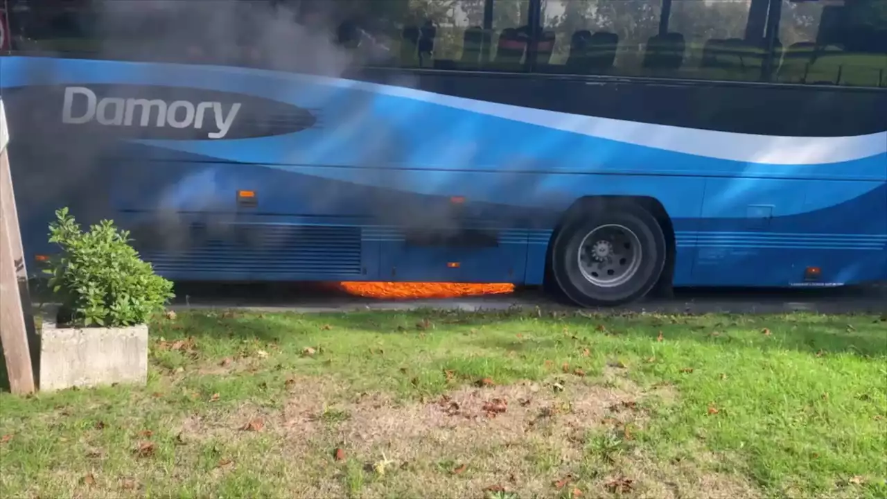 Shocking moment bus with screaming kids on board bursts into flames