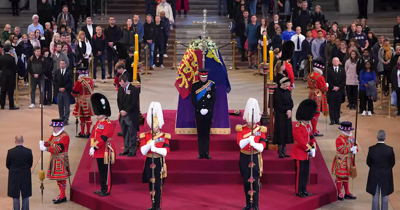 Prince William and Prince Harry stand vigil beside the queen’s coffin