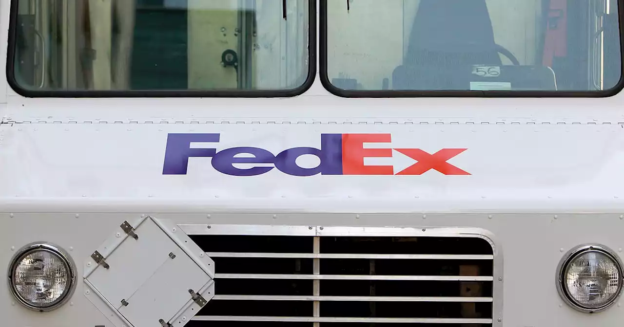 FedEx to close stores and freeze hiring as demand slumps