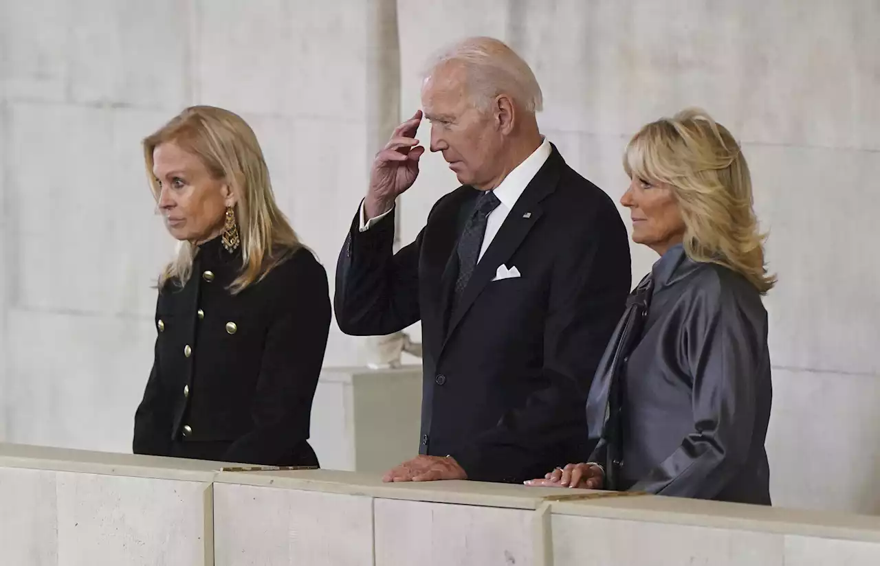 Live updates: Bidens pay their respects at queen's coffin