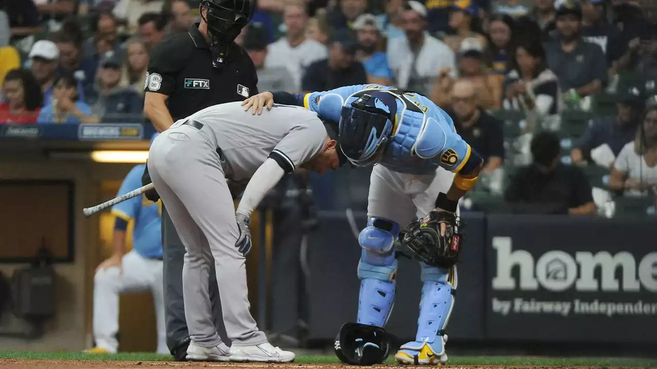 Yankees' Marwin Gonzalez hit in helmet by errant throw from Brewers catcher Victor Caratini