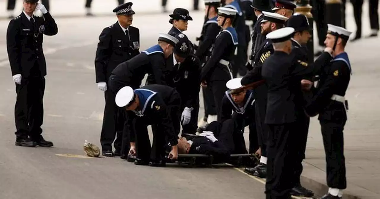 Police officer collapses and is carried away at Queen's funeral