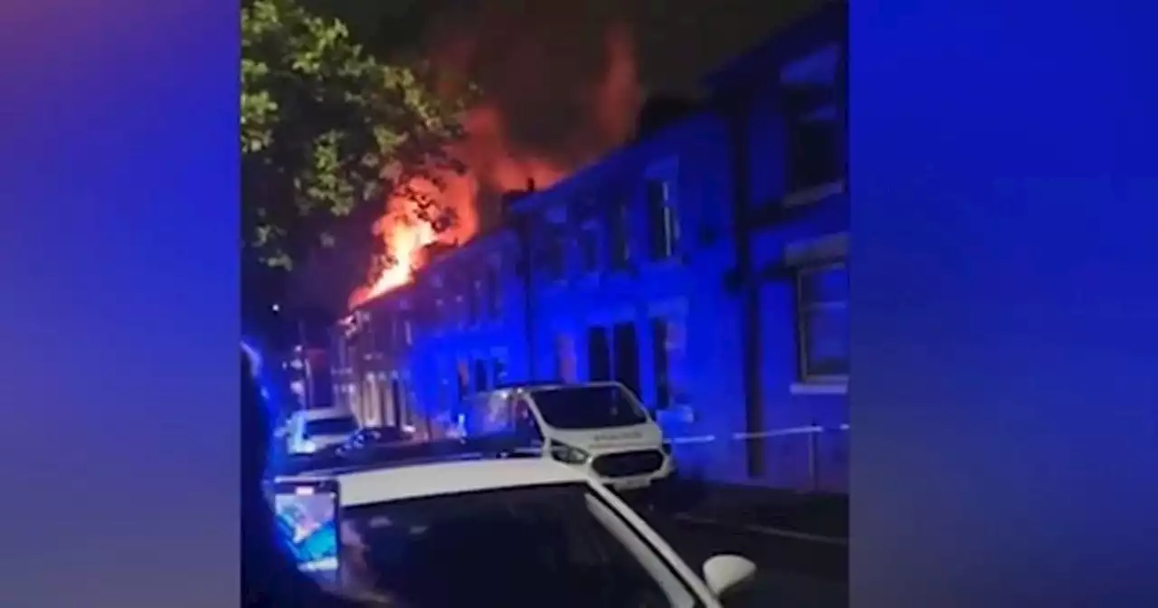 Moment fire tears through house as huge flames and smoke billow from roof