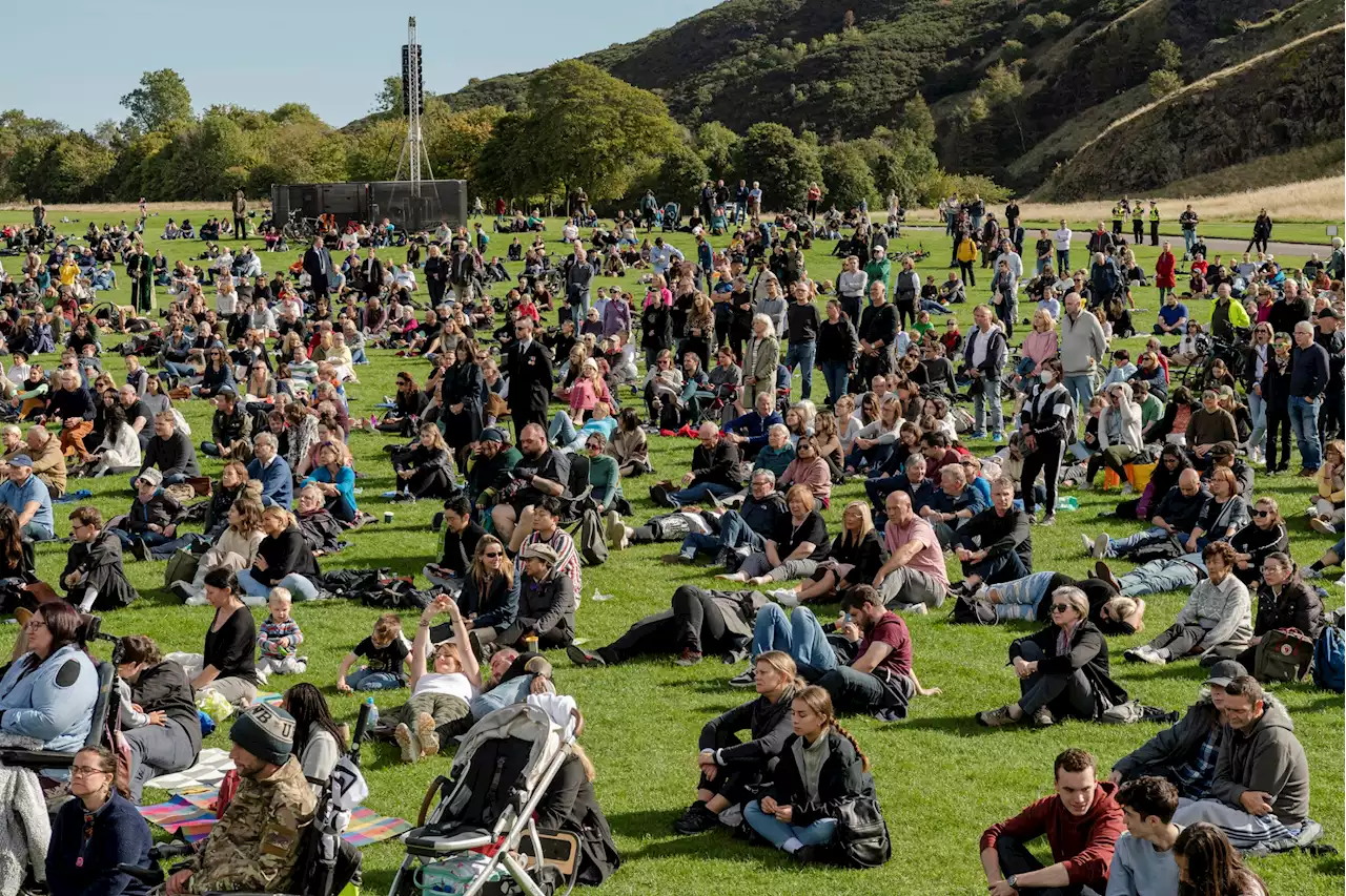 Crowd in Edinburgh gathers around big screen in Holyrood Park to watch Queen's funeral